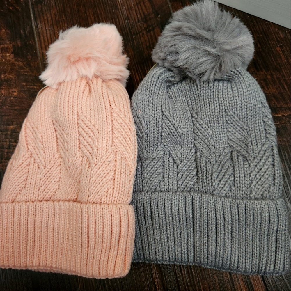 A set of 2 Cable Knit Beanie Hats with Pom Poms; Pink; Gray